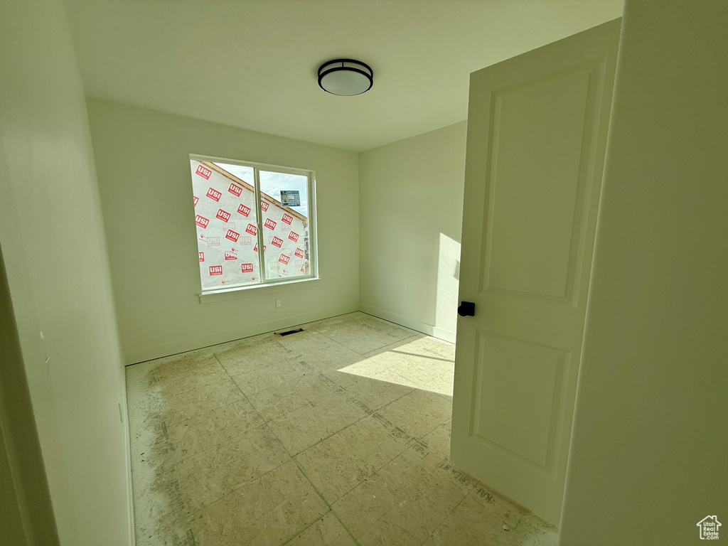 Unfurnished room with tile patterned floors