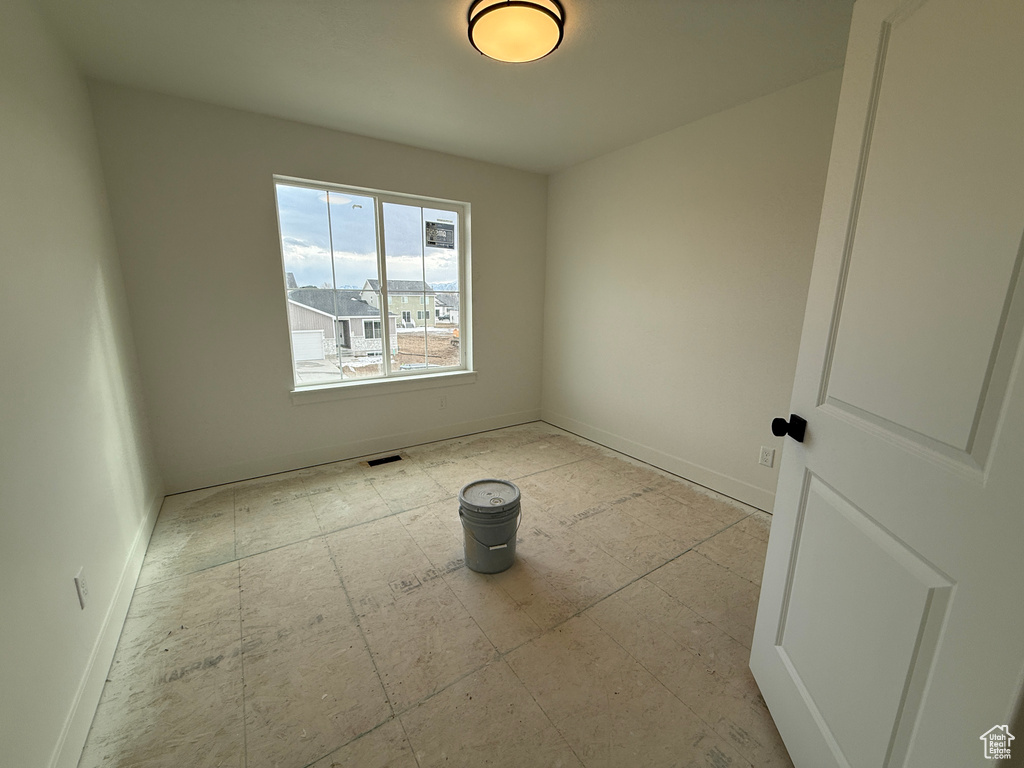 Empty room featuring visible vents