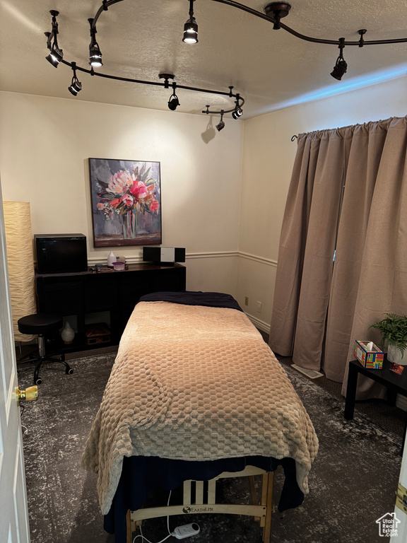 Bedroom featuring a textured ceiling
