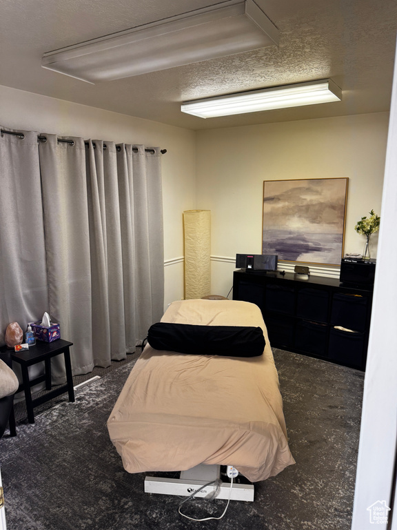 Bedroom featuring a textured ceiling