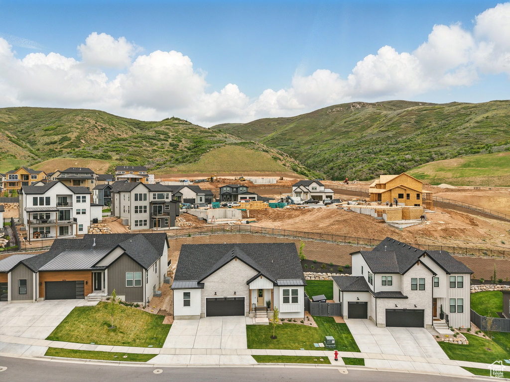 Aerial view of residential area with a mountain backdrop
