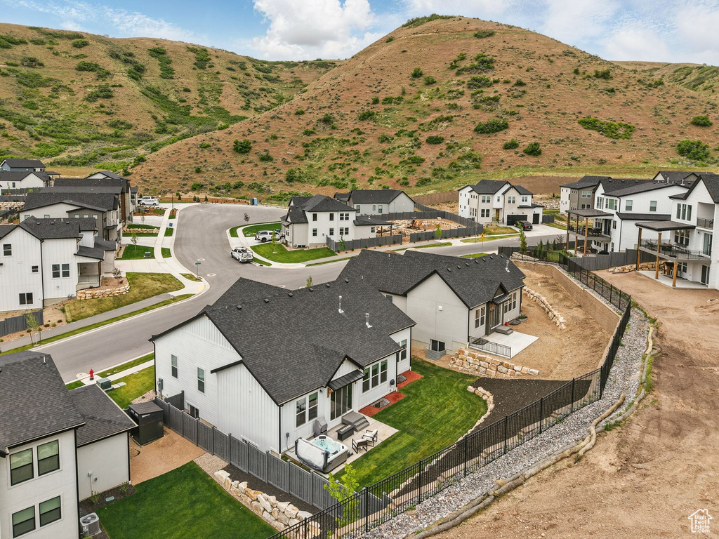 Aerial perspective of suburban area featuring a mountain backdrop