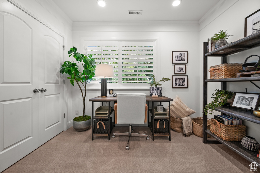 Carpeted home office with recessed lighting, visible vents, and crown molding