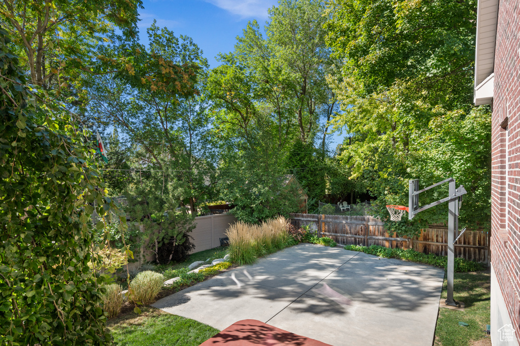 View of patio / terrace featuring basketball court and a fenced backyard