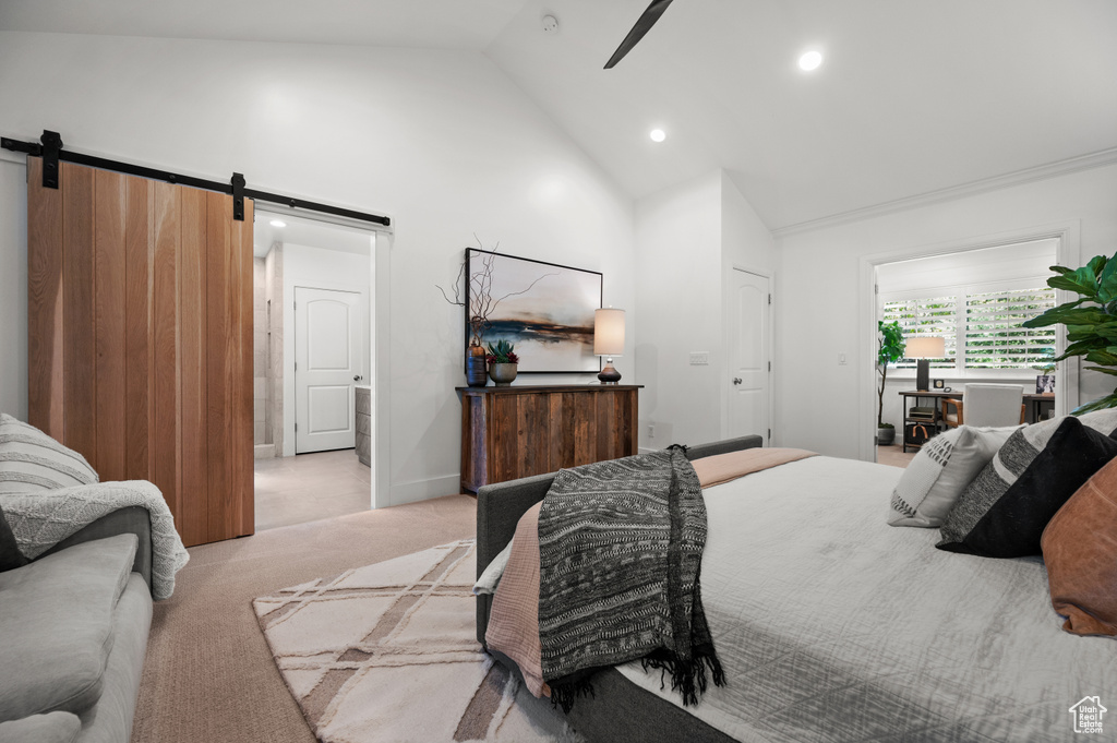 Bedroom featuring light carpet, recessed lighting, high vaulted ceiling, and a barn door