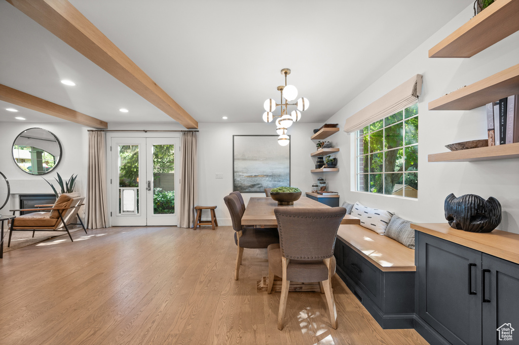 Dining room with recessed lighting, beamed ceiling, plenty of natural light, and light wood-style floors