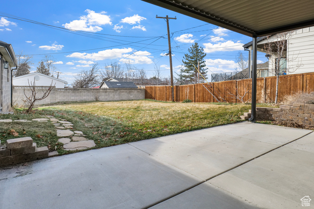 View of yard with a patio and a fenced backyard