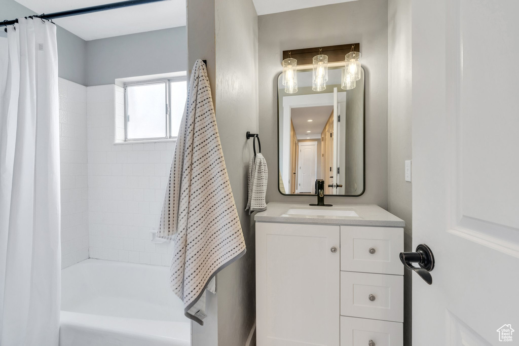 Bathroom with vanity and shower / bath combo