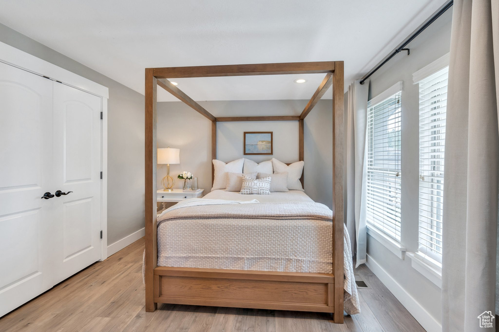 Bedroom featuring baseboards and light wood-style flooring