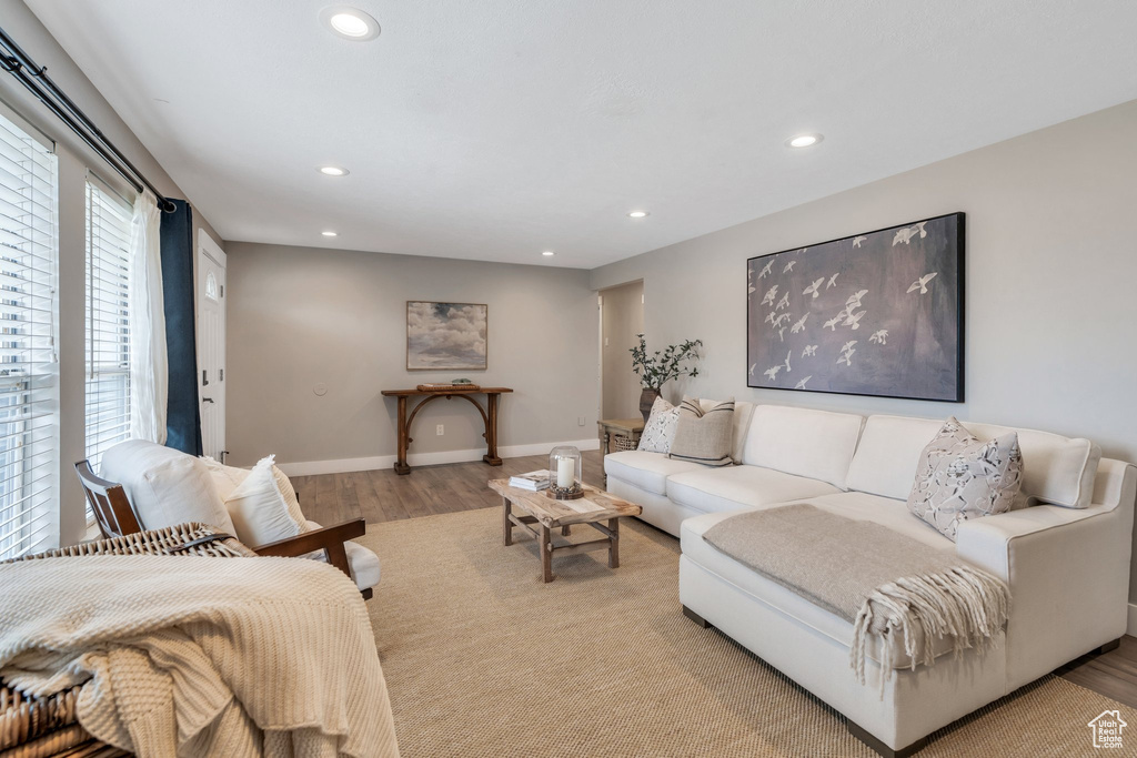 Living room featuring recessed lighting, light wood finished floors, and baseboards