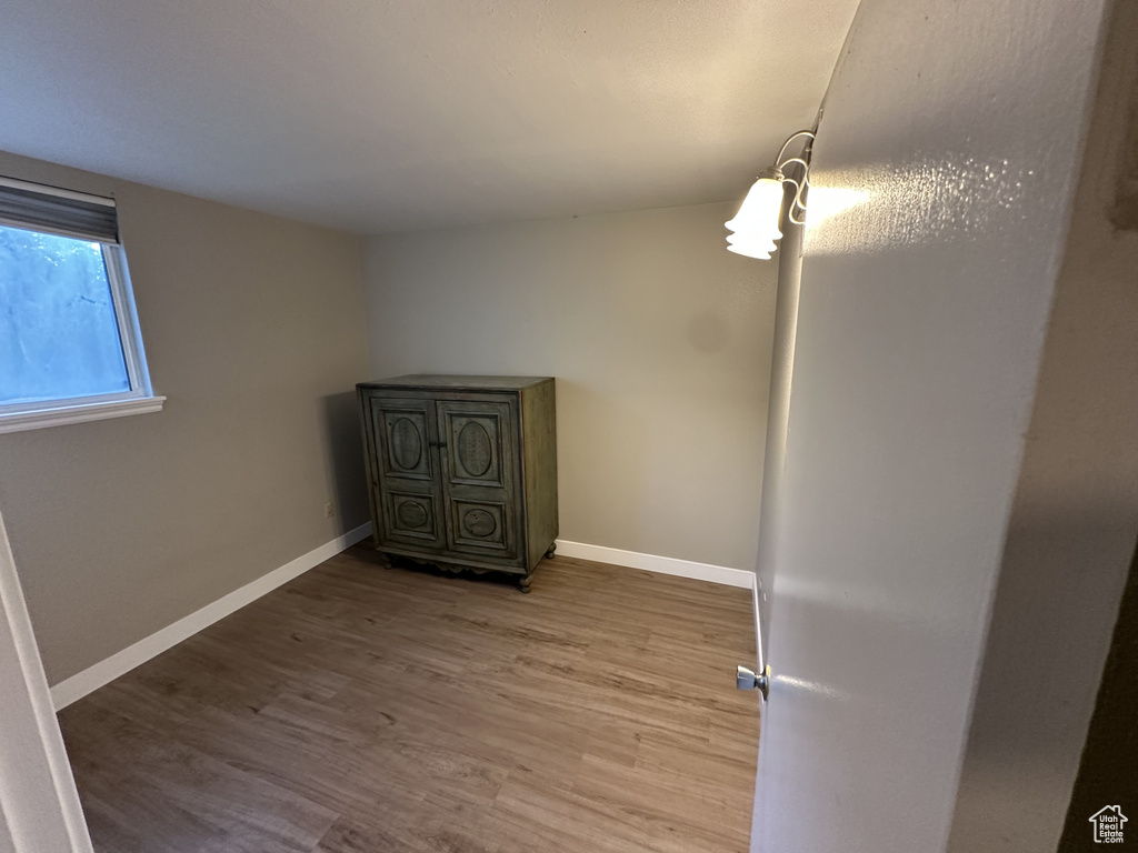 Spare room with wood finished floors and baseboards