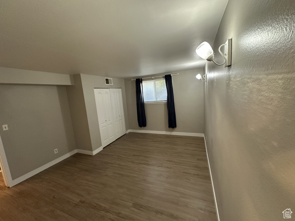 Spare room with wood finished floors and baseboards