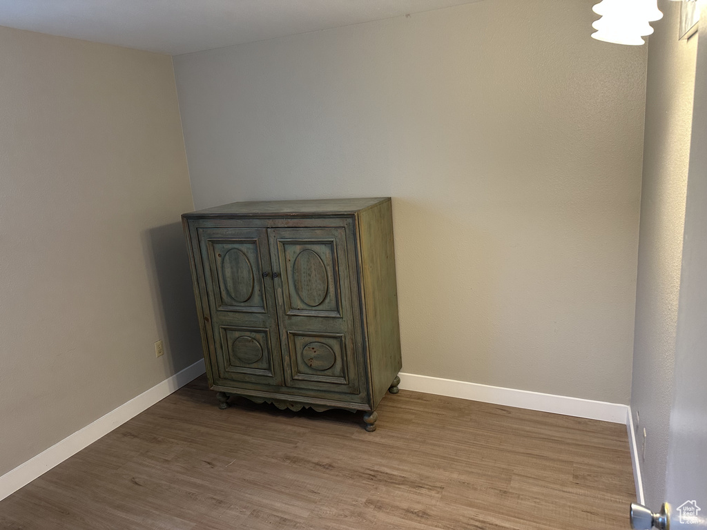 Detailed view of wood finished floors and baseboards