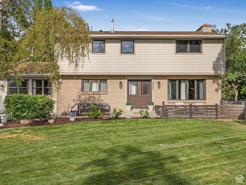 View of front of property with a front lawn