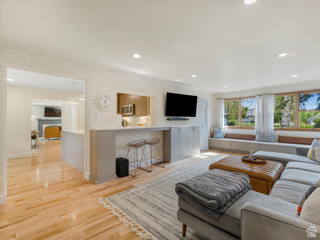 Living room with light hardwood / wood-style floors