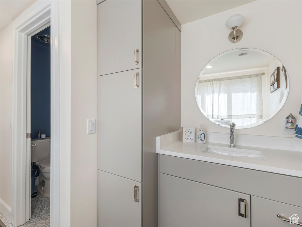 Bathroom featuring vanity and toilet