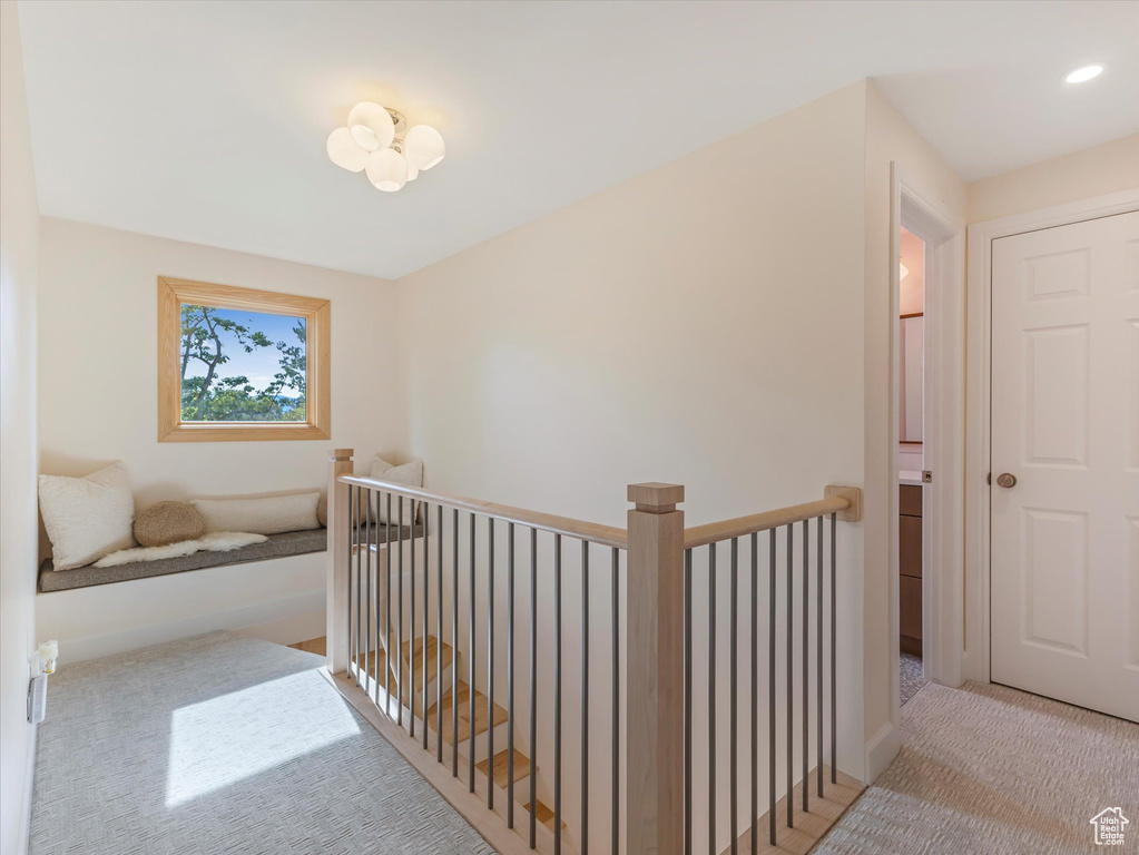 Hallway with light colored carpet