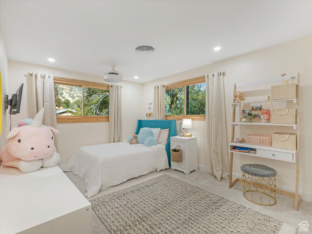 Bedroom featuring multiple windows