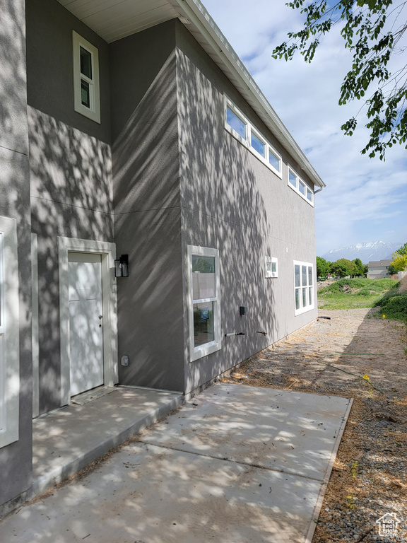 View of side of property featuring a patio