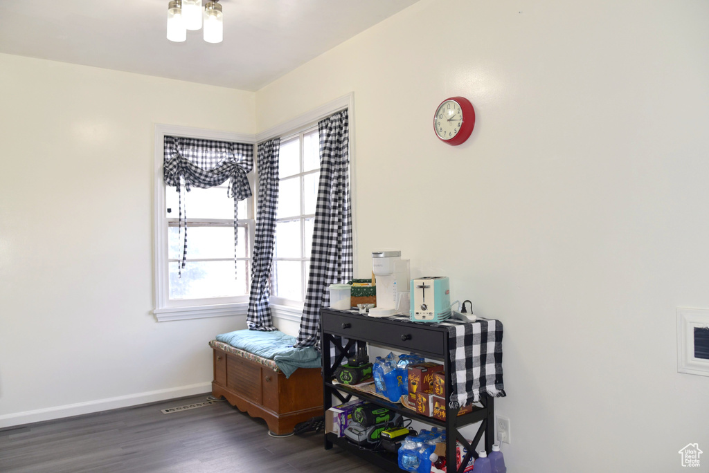 Interior space featuring a wealth of natural light, baseboards, and wood finished floors