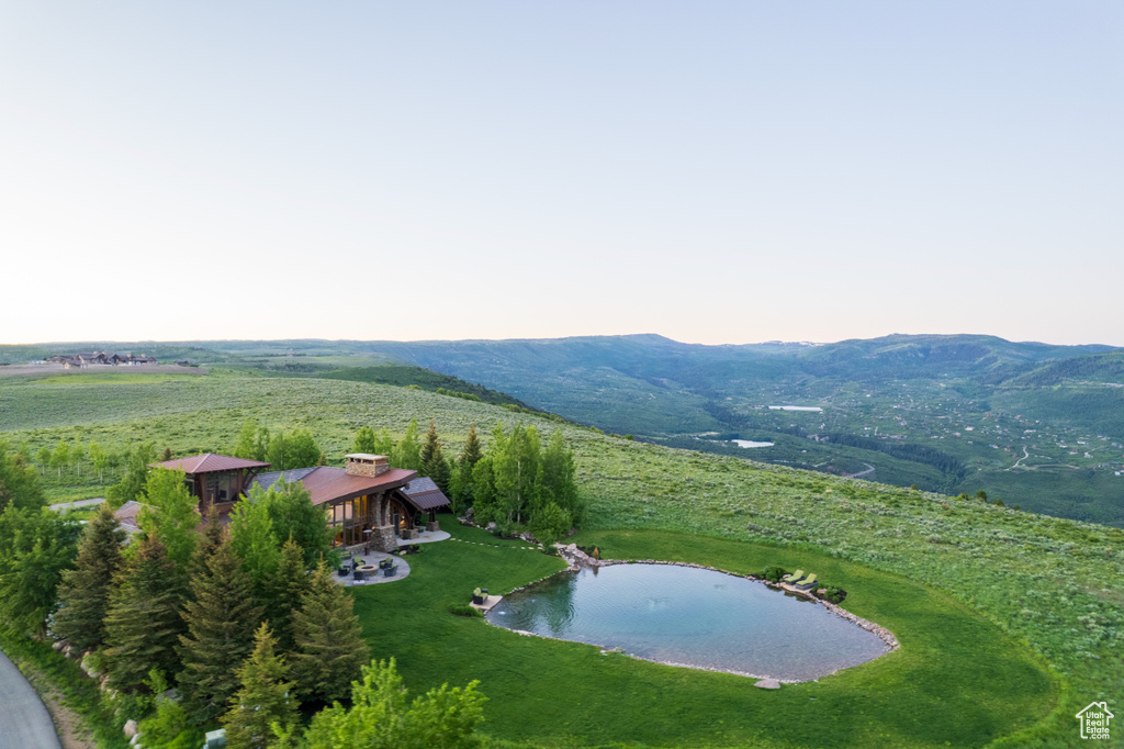 Aerial overview of property\'s location with a mountainous background