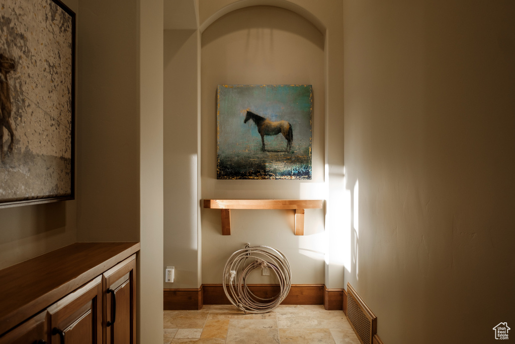 Hall with light stone finish flooring