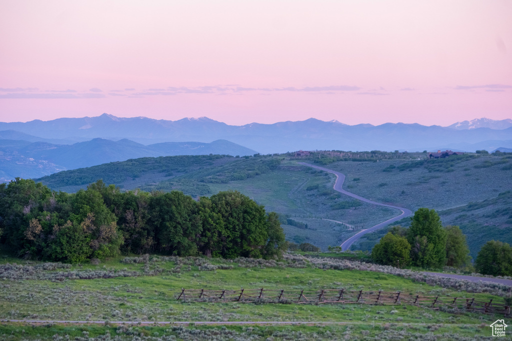 View of mountain background featuring rural landscape