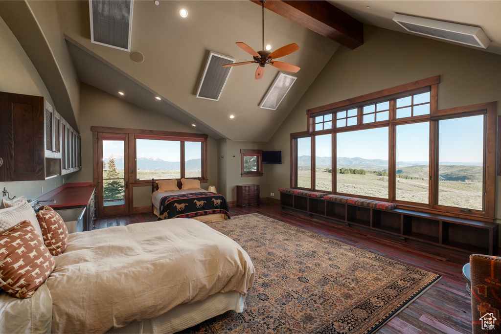 Bedroom featuring high vaulted ceiling, access to outside, beamed ceiling, recessed lighting, and wood finished floors