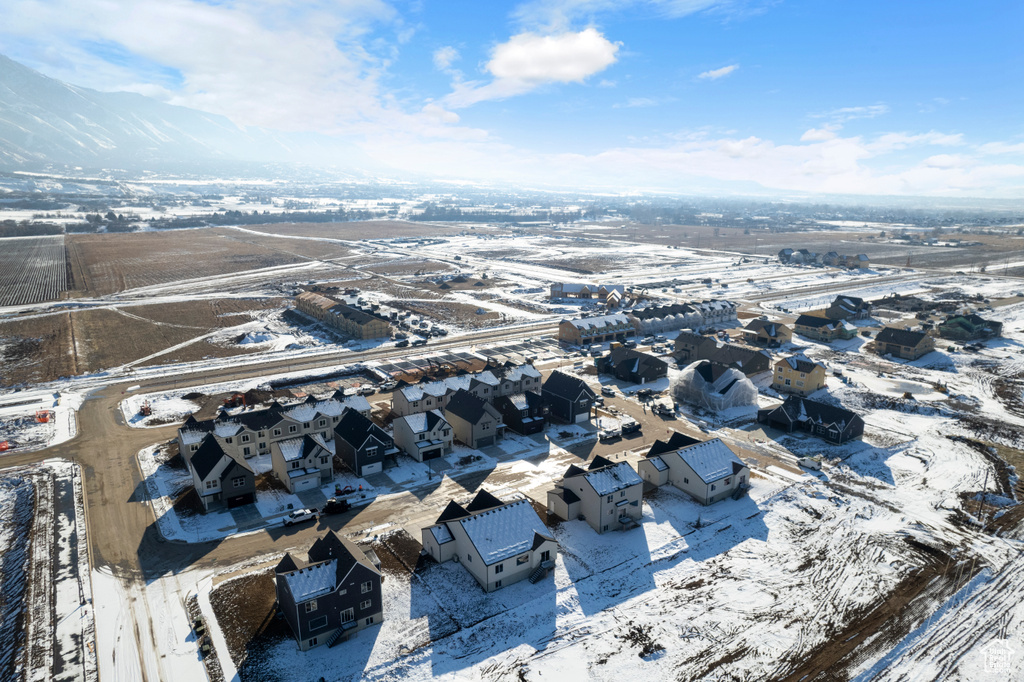Snowy aerial view featuring a residential view