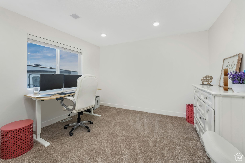 Home office with recessed lighting, baseboards, and light carpet