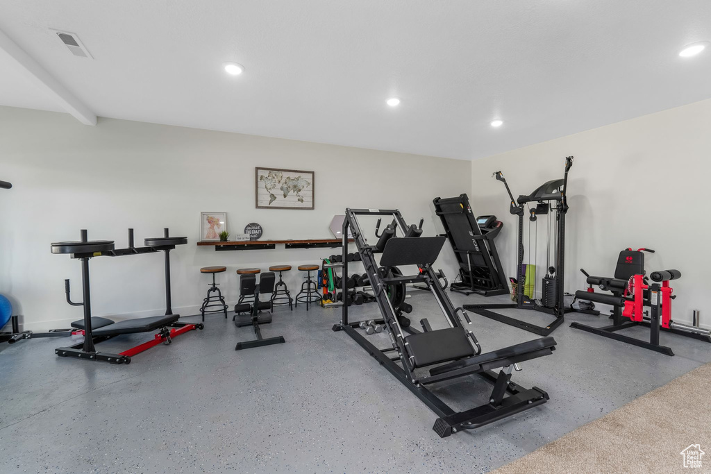 Exercise room featuring recessed lighting and visible vents