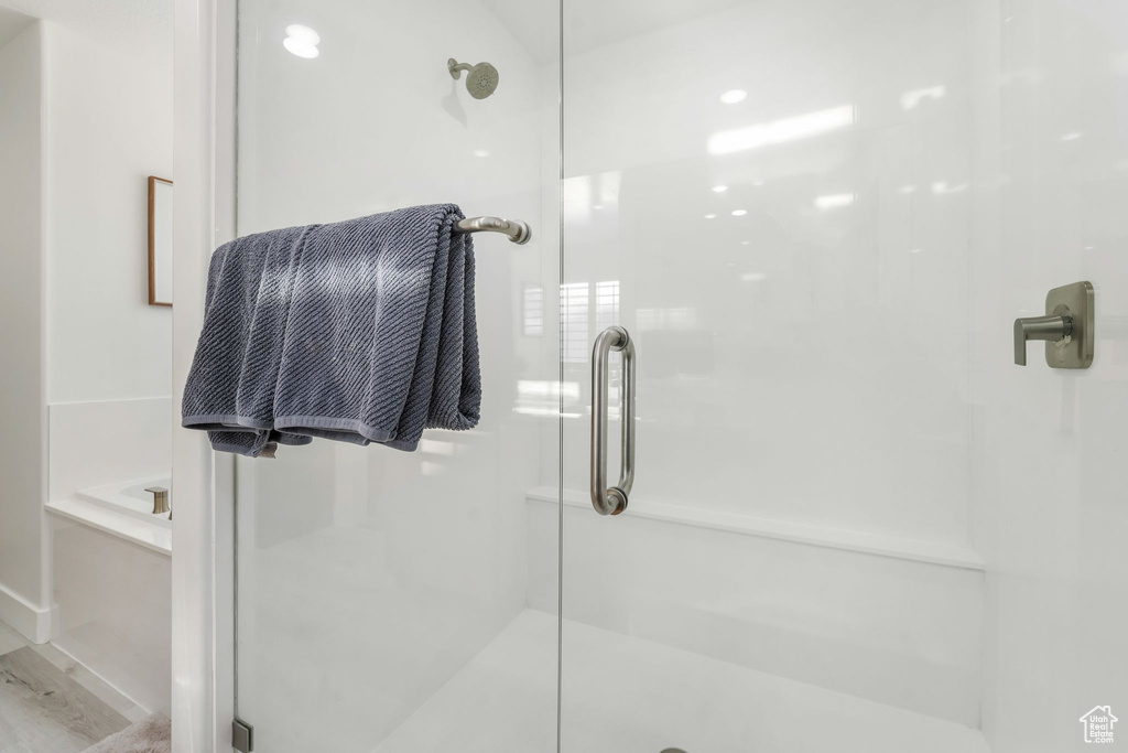 Full bathroom with a shower stall and a garden tub