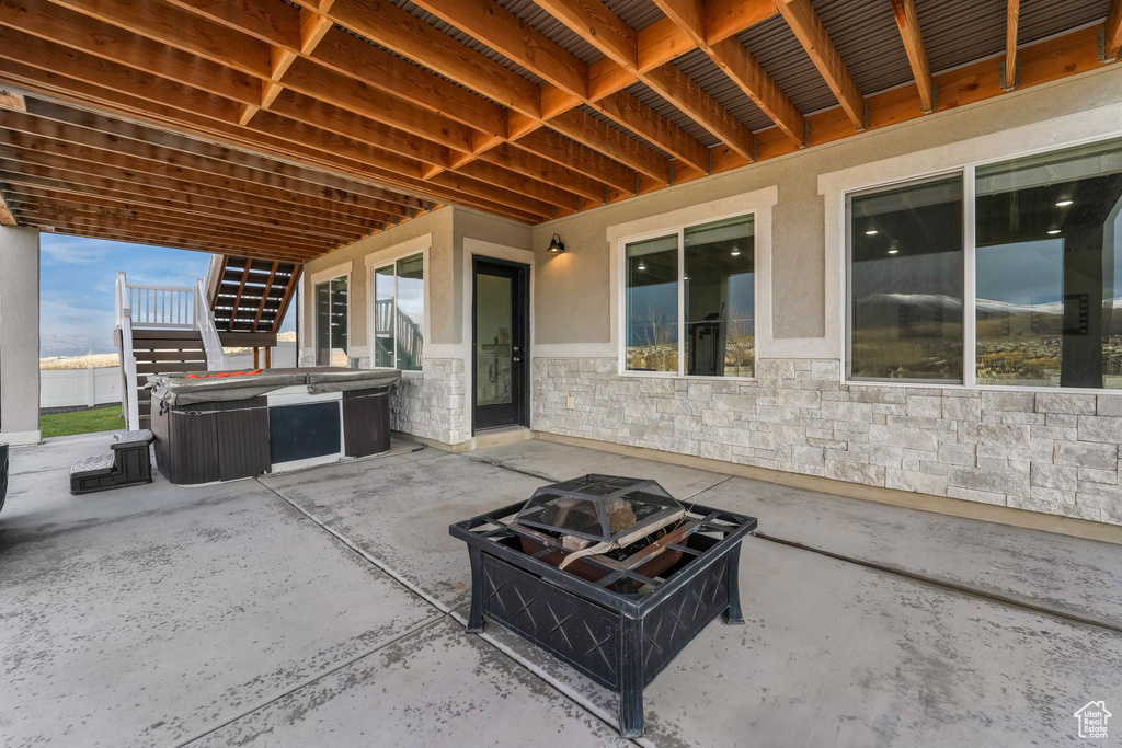 View of patio / terrace with a hot tub