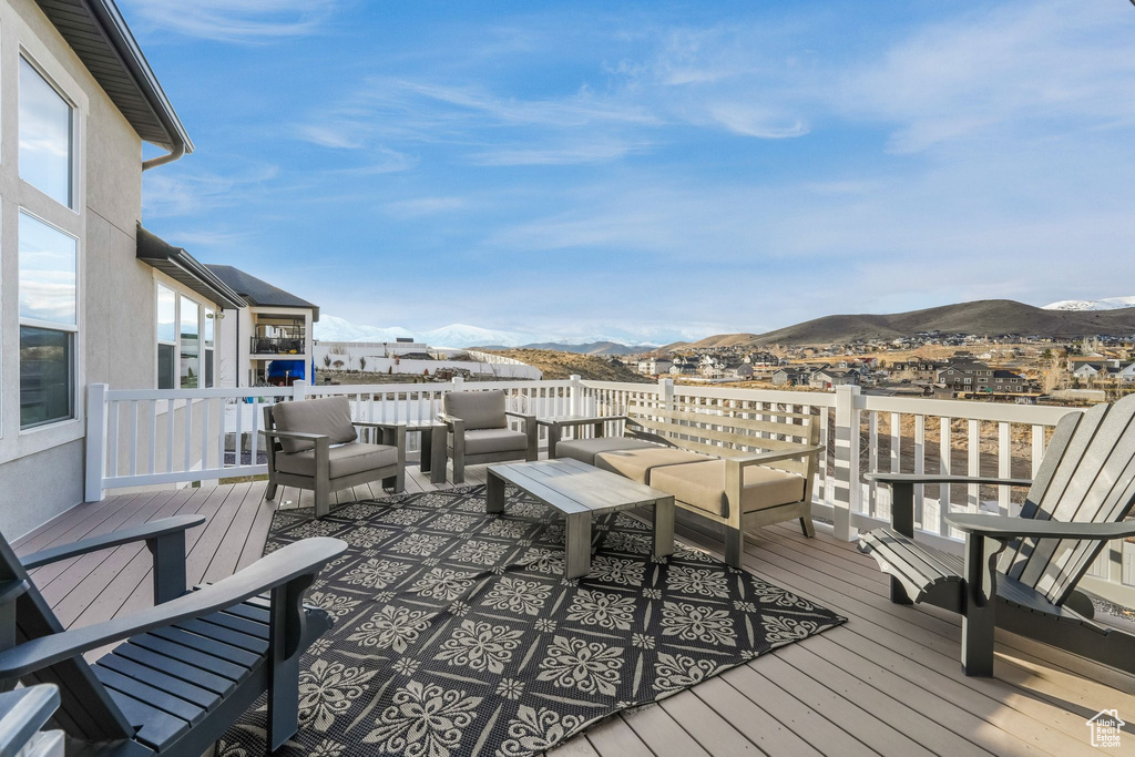Wooden terrace featuring a mountain view