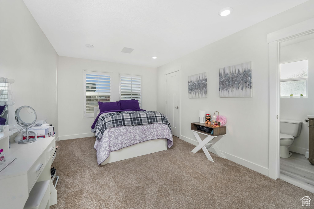 Bedroom featuring carpet flooring, recessed lighting, ensuite bathroom, and baseboards
