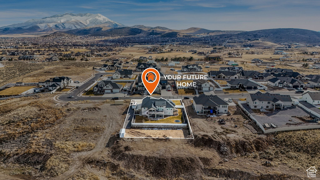 Drone / aerial view featuring a mountain view and a residential view