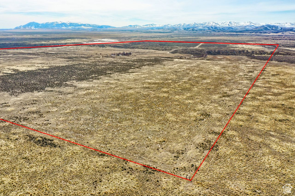 Birds eye view of property with a rural view and a mountain view