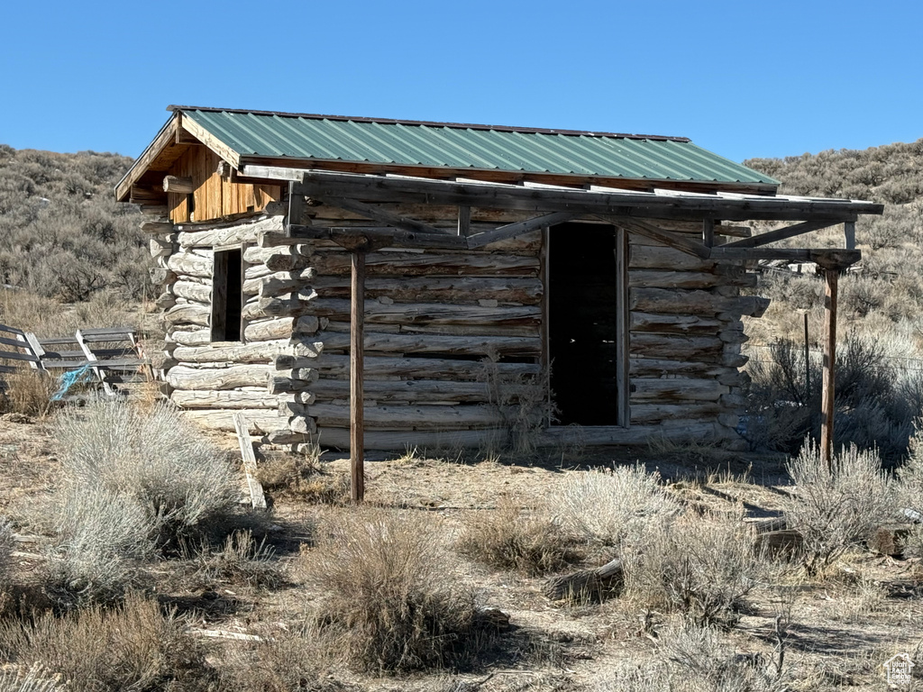 View of outbuilding with an outdoor structure
