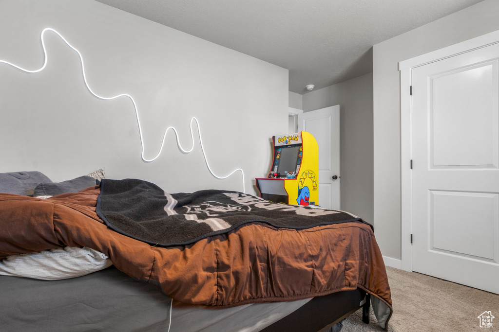 Bedroom with baseboards and carpet flooring