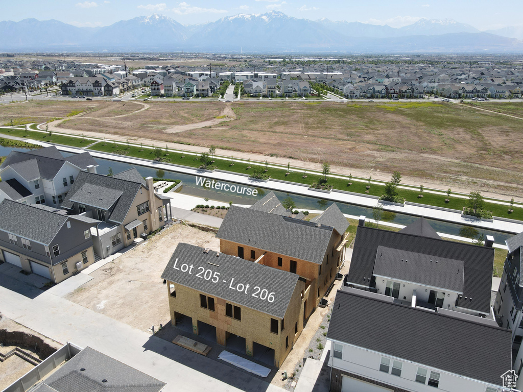 Aerial perspective of suburban area with a mountainous background