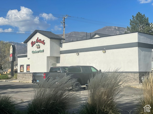 View of building exterior featuring a mountain view