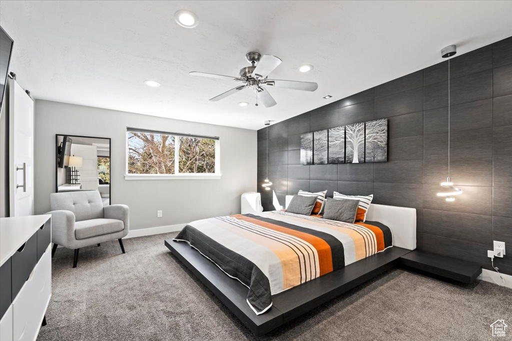 Carpeted bedroom with an accent wall, recessed lighting, baseboards, and ceiling fan