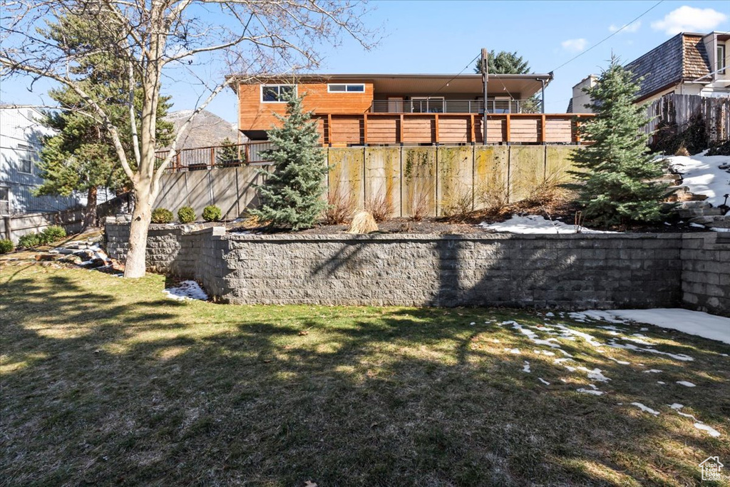 View of yard featuring fence