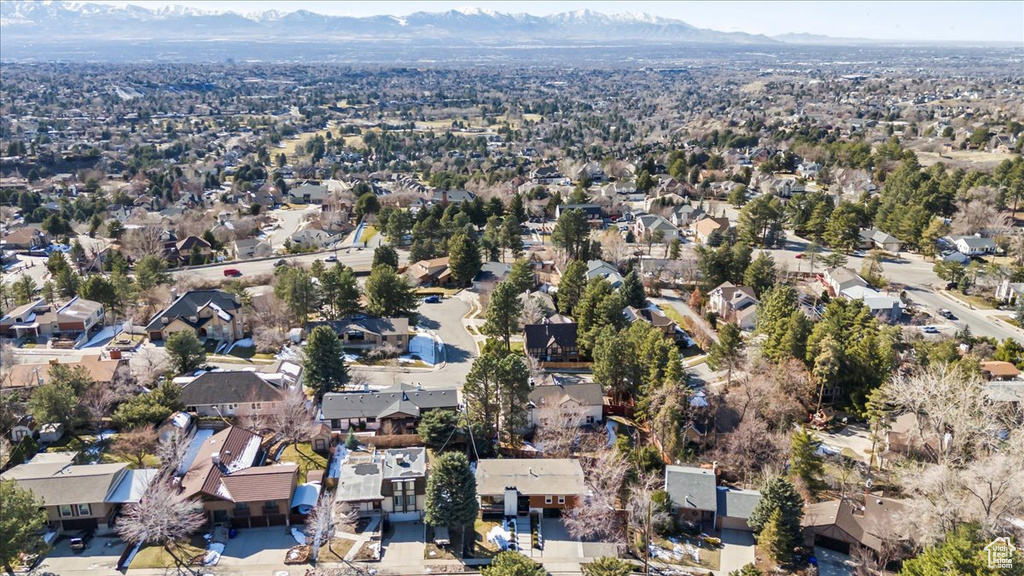 Birds eye view of property featuring a mountain view and a residential view