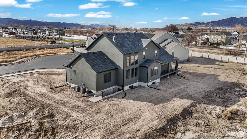 Birds eye view of property featuring a mountain view and a residential view