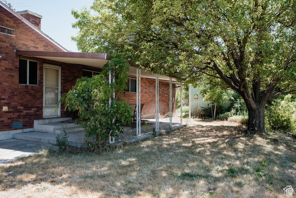 View of yard featuring entry steps
