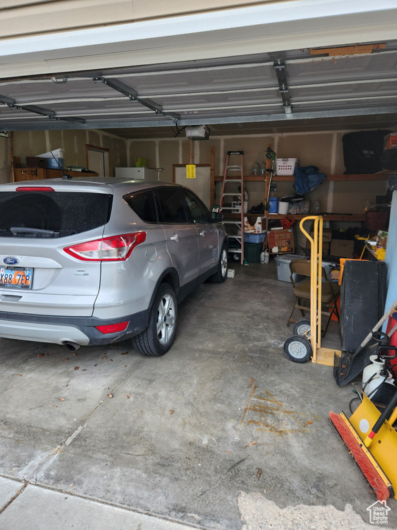Garage featuring a garage door opener