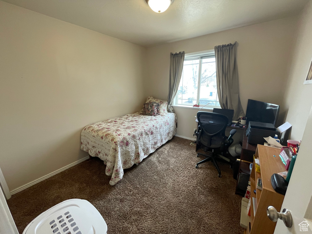 Carpeted bedroom with baseboards
