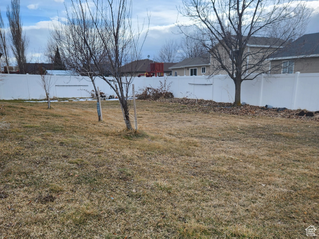 View of yard with fence