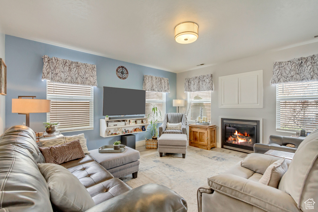 Living room with a glass covered fireplace